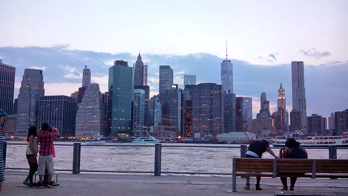Lower Manhattan skyline at dusk viewed from Brooklyn Bridge Park