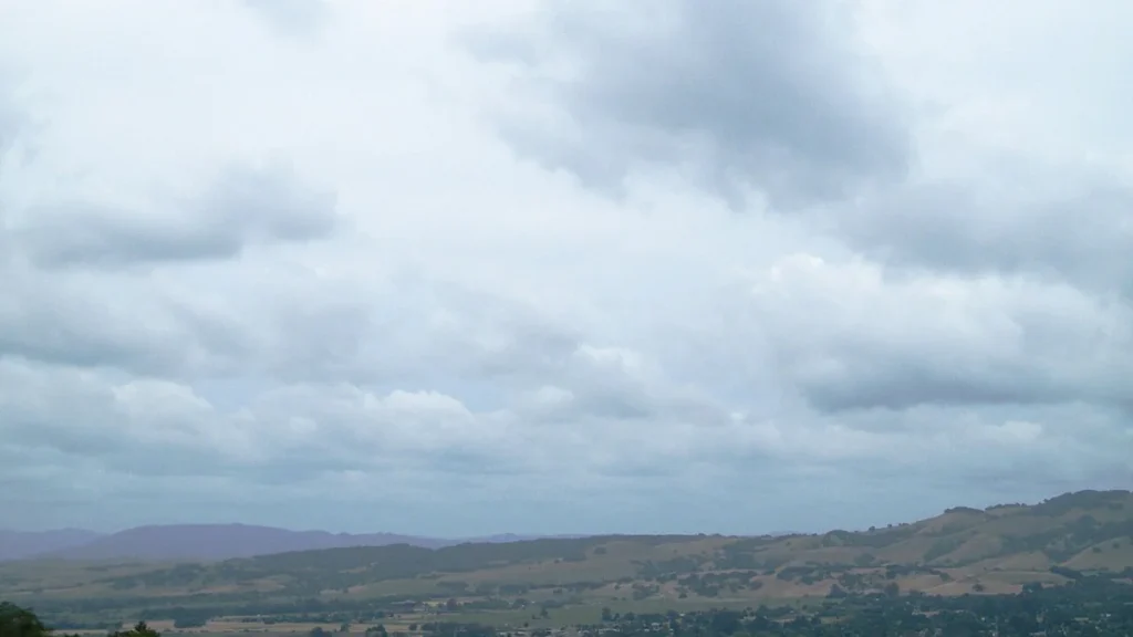 Vineyards and rolling hills of Sonoma Valley beneath clouds