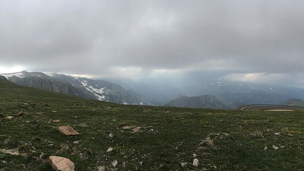 Beartooth Highway crossing open alpine country under low clouds